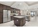 Bright kitchen boasts stainless appliances, a center island, and opens to the dining and living areas at 16300 County Road 455 # 204, Montverde, FL 34756