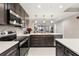 Well-equipped kitchen with a stainless steel range, sleek microwave, and plenty of counter space at 16300 County Road 455 # 204, Montverde, FL 34756