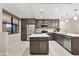 Modern kitchen with stainless steel appliances, center island, and stylish cabinets with quartz countertops at 16300 County Road 455 # 204, Montverde, FL 34756