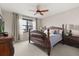 Serene main bedroom with elegant furniture, soft lighting, and a large window offering natural light at 16300 County Road 455 # 204, Montverde, FL 34756