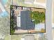 Drone view of the entire home showcasing the roof, backyard, and surrounding foliage at 194 Larkspur Ct, Kissimmee, FL 34743