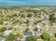 Aerial drone shot of a suburban neighborhood with many houses and green trees during the day at 194 Larkspur Ct, Kissimmee, FL 34743