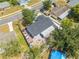 Aerial shot showcases home's roof, backyard, and proximity to nearby streets and neighborhoods at 194 Larkspur Ct, Kissimmee, FL 34743