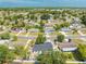 The aerial view of the neighborhood with the property below showcasing many houses in the area at 194 Larkspur Ct, Kissimmee, FL 34743