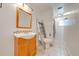 Bathroom featuring a single sink vanity and toilet with decorative ladder at 194 Larkspur Ct, Kissimmee, FL 34743