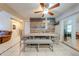 The dining room features a stylish accent wall, ceiling fan, and tile flooring at 194 Larkspur Ct, Kissimmee, FL 34743
