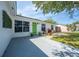 This is a close-up of the home with a bright green front door at 194 Larkspur Ct, Kissimmee, FL 34743