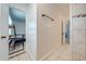 Hallway leading to a bedroom with tiled floors and neutral-colored walls at 194 Larkspur Ct, Kissimmee, FL 34743
