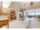 Bright kitchen view into the open concept layout, with tile floors and stainless steel appliances at 194 Larkspur Ct, Kissimmee, FL 34743