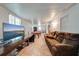 Relaxing living room features a large TV and comfortable seating providing an inviting space for relaxation and entertainment at 194 Larkspur Ct, Kissimmee, FL 34743