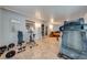 Recreation area with exercise equipment, French doors, and easy access to pool table at 194 Larkspur Ct, Kissimmee, FL 34743