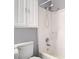 This bathroom shows a shower-tub with modern shower head and white cabinets at 1961 Lochshyre Loop, Ocoee, FL 34761
