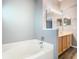 Bright bathroom featuring a soaking tub and an expansive vanity at 1961 Lochshyre Loop, Ocoee, FL 34761