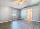 Spacious bedroom with a large window for natural light and neutral-toned walls and flooring at 1961 Lochshyre Loop, Ocoee, FL 34761