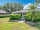 Well-maintained home with stone flower beds and mature landscaping at 1961 Lochshyre Loop, Ocoee, FL 34761
