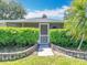 Charming single-story house with manicured lawn and lush landscaping at 1961 Lochshyre Loop, Ocoee, FL 34761