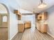 Open kitchen with wood cabinets and a view of the living room at 1961 Lochshyre Loop, Ocoee, FL 34761