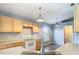 Functional kitchen featuring ample cabinetry, modern appliances, and convenient breakfast bar at 1961 Lochshyre Loop, Ocoee, FL 34761
