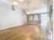Spacious living room with vaulted ceilings, wood-look floors, arched doorways and lots of natural light at 1961 Lochshyre Loop, Ocoee, FL 34761