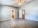 Neutral-toned main bedroom with access to the bathroom and walk-in closet at 1961 Lochshyre Loop, Ocoee, FL 34761