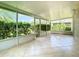 View of the tiled and screened-in patio space with views of the outdoors at 1961 Lochshyre Loop, Ocoee, FL 34761