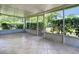 Spacious screened patio with tile flooring and views of lush landscaping at 1961 Lochshyre Loop, Ocoee, FL 34761