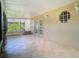 Tiled and screened-in patio space features double doors and large openings at 1961 Lochshyre Loop, Ocoee, FL 34761