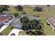 Spacious home features an inviting backyard, lush green lawn, and a long driveway leading to a two-car garage at 212 Terranova Blvd, Winter Haven, FL 33884