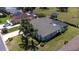 Inviting property features a refreshing pool, a screened enclosure, a well-maintained lawn, and mature landscaping at 212 Terranova Blvd, Winter Haven, FL 33884