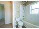 Bathroom featuring a tub and shower combination and wallpaper at 212 Terranova Blvd, Winter Haven, FL 33884