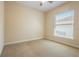 Cozy bedroom with neutral carpet and natural light from the window at 212 Terranova Blvd, Winter Haven, FL 33884