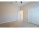 Bedroom with carpet, closet and a ceiling fan for enhanced comfort at 212 Terranova Blvd, Winter Haven, FL 33884