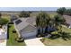 Lovely single-story home with solar panels features a landscaped yard and a convenient two-car garage at 212 Terranova Blvd, Winter Haven, FL 33884