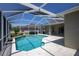 Screened in pool area with mature landscaping and ample room for seating at 212 Terranova Blvd, Winter Haven, FL 33884