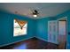 This bedroom features hardwood floors, and a window for plenty of natural light at 2209 Pecos Ct, Poinciana, FL 34759