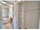 Spacious closet with built-in shelving and walk-in access with bathroom view at 2209 Pecos Ct, Poinciana, FL 34759