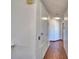 Hallway with hardwood floors and white walls at 2209 Pecos Ct, Poinciana, FL 34759