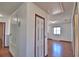 This hallway features hardwood floors, with access to other rooms in the house at 2209 Pecos Ct, Poinciana, FL 34759