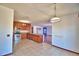 The kitchen has tile floors, wooden cabinets, and stainless appliances at 2209 Pecos Ct, Poinciana, FL 34759