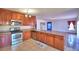 Kitchen featuring stainless appliances and wooden cabinets at 2209 Pecos Ct, Poinciana, FL 34759