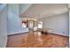Open living room featuring wood floors, decorative columns, and natural light at 2209 Pecos Ct, Poinciana, FL 34759