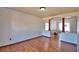 Spacious living room with hardwood floors, archway, and natural light at 2209 Pecos Ct, Poinciana, FL 34759