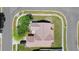 Aerial view of a home with a brown roof, manicured lawn, and a two-car driveway at 2645 Debany Rd, Kissimmee, FL 34744