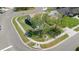 Aerial view of a single-story house on a corner lot with mature trees and well-kept landscaping at 2645 Debany Rd, Kissimmee, FL 34744