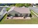 Aerial view of a home's backyard featuring a brick patio and outdoor seating area at 2645 Debany Rd, Kissimmee, FL 34744
