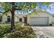 Charming single-story home with a two-car garage and well-maintained lawn at 2645 Debany Rd, Kissimmee, FL 34744