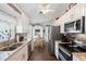 Modern kitchen with stainless steel appliances, granite countertops, and white cabinetry at 2645 Debany Rd, Kissimmee, FL 34744