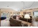 Open-concept living space with hardwood floors, comfortable seating, and bright lighting at 2645 Debany Rd, Kissimmee, FL 34744