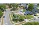 Aerial view shows a house in a residential neighborhood with mature trees and manicured lawns at 2645 Debany Rd, Kissimmee, FL 34744