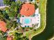 Stunning aerial view of the community pool, spa, and recreation center with lush landscaping and amenities at 2712 Lido Key Dr, Kissimmee, FL 34747